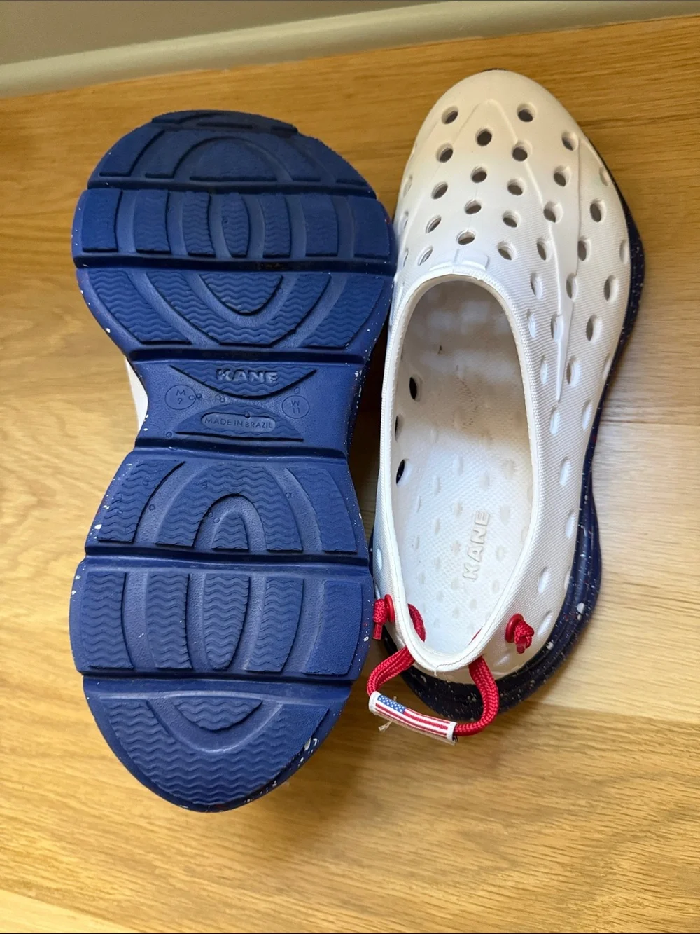 Men’s Kane shoes white with blue bottom and white and red speckles